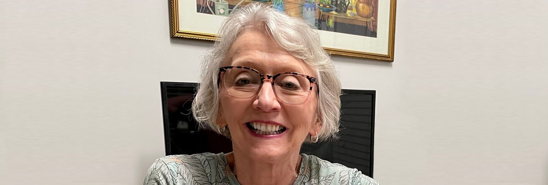 Resident Rosemary sitting in front of a computer
