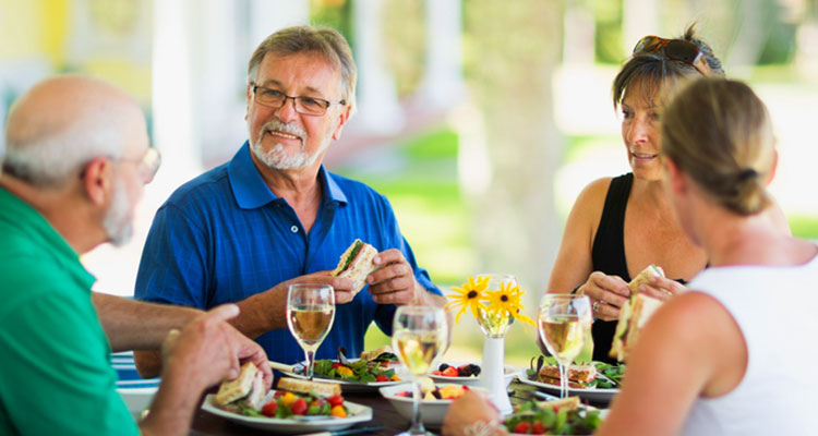 Senior friends eating lunch