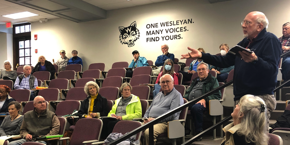 man speaking in a classroom