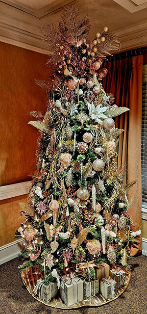 decorated tree with gifts under tree