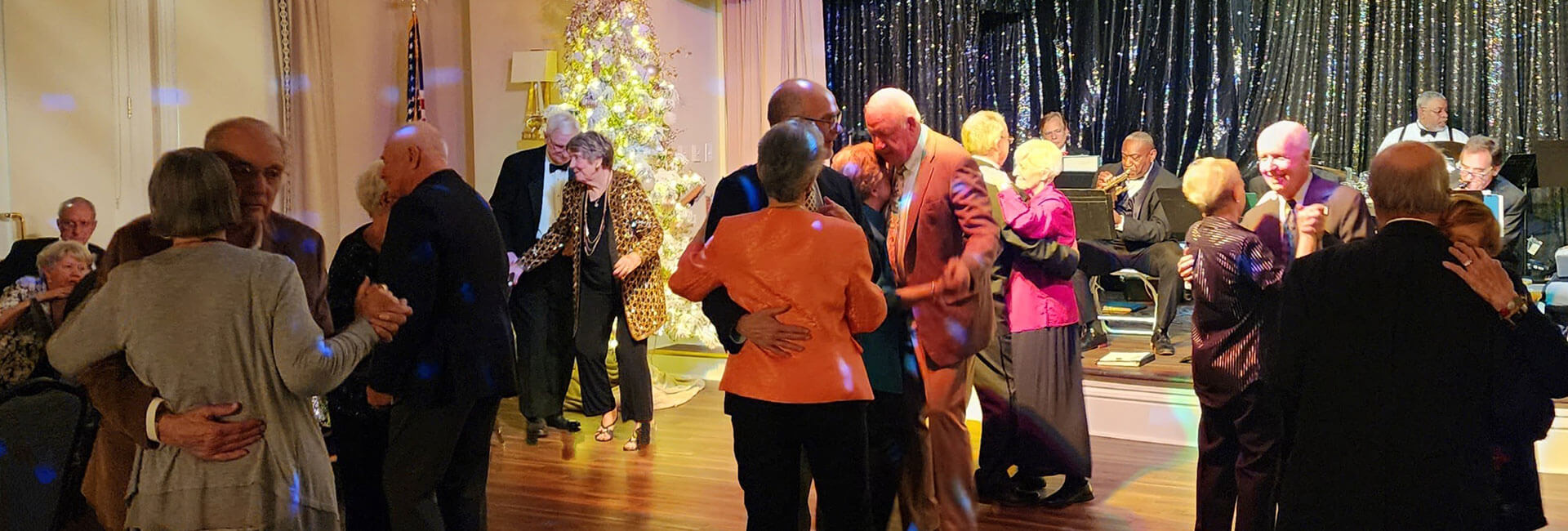 Couples dancing around ballroom