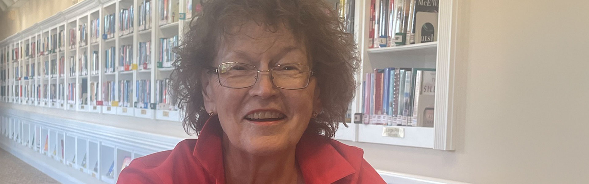 Senior woman in library.