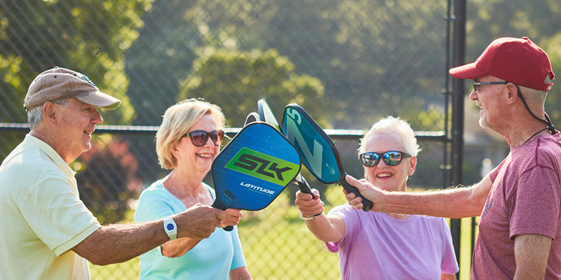 Group playing pickleball